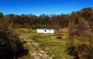 image of off-grid container home in forest